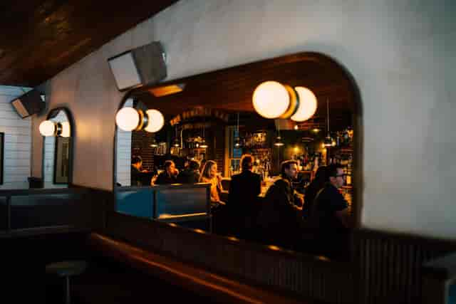 East Bar venue for corporate happy hour and private networking events with warm moody lighting.