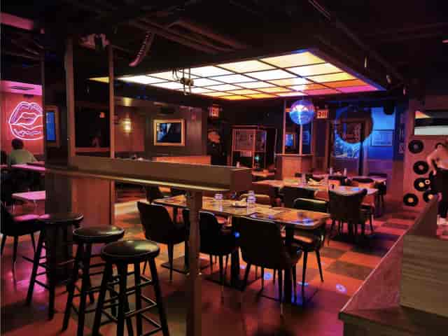 Woo Woo NYC venue with neon lighting, perfect for social gatherings and networking events.