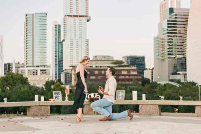 Urban chic marriage proposal at Limestone Rooftop with iconic skyline backdrop.