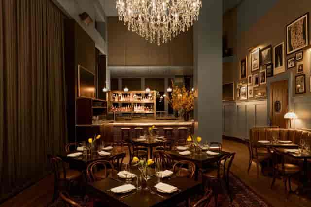 Upscale private event space in NYC with chandelier for executive dinners and boutique networking.