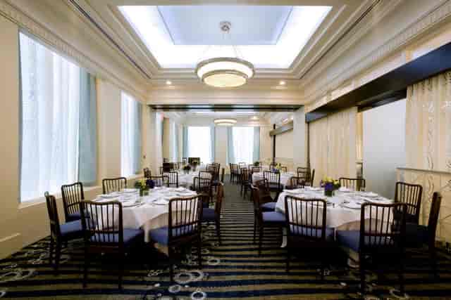 Salon North banquet space with round tables for corporate luncheons and upscale social events.
