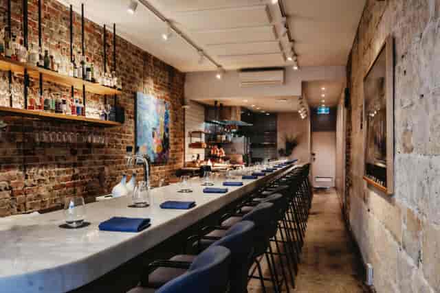 Sophisticated Chef’s Counter with marble bar for corporate receptions and networking events.