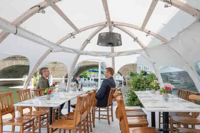 River Room marquee setup for corporate activation and waterfront event dining.