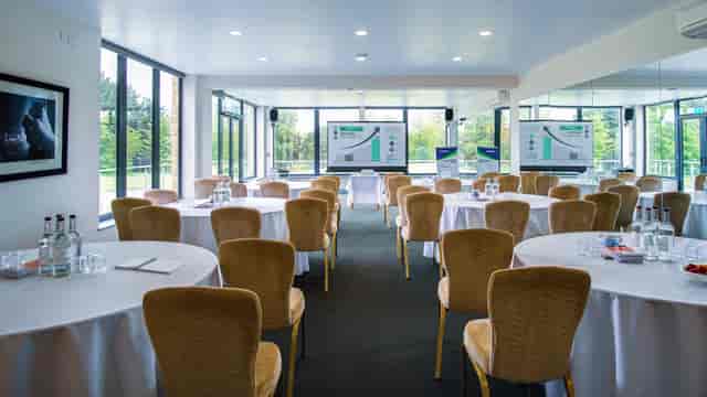 The River Room at The Folly: bright corporate meeting space with floor-to-ceiling windows.