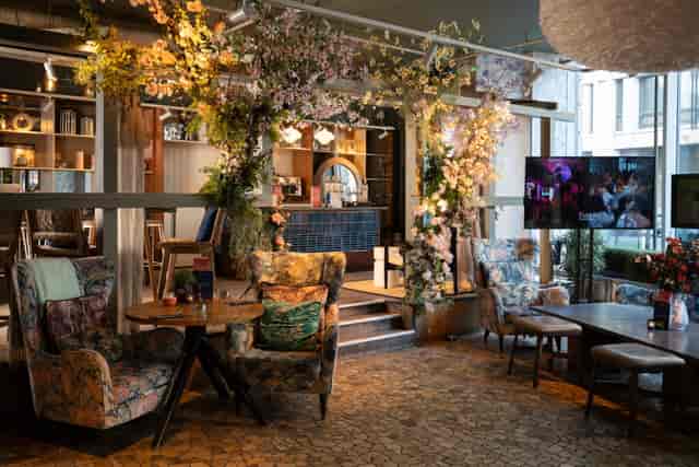 Main Restaurant at The Folly: Chic lounge with floral decor for VIP networking and social events.