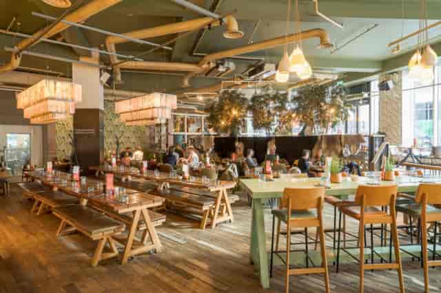 Industrial-chic Main Restaurant venue for networking mixers and team lunches.