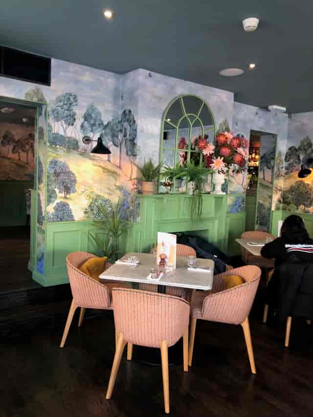 Brasserie Blanc Oxford venue featuring floral fireplace mantle for networking and dinner events.
