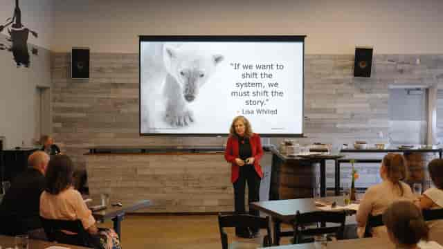 Speaker presenting in a David Lloyd Oxford clubroom for corporate events and professional meetings.