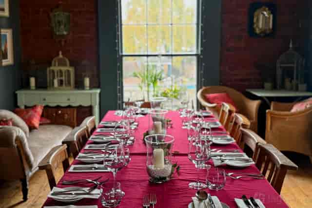 Intimate private dining setup at White Dome, The Folly with bold eclectic decor for luxury events.