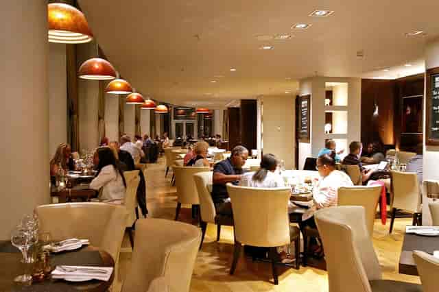 Manhattan Grill corporate dining room with elegant seating for executive meetings and networking.