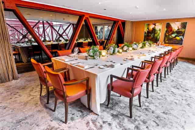Boardroom dining at The Courtyard, Notting Hill with orange chairs for executive events and meetings.