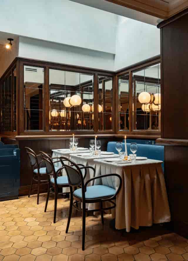 Intimate private dining at Chef’s Table, Henrietta Experimental with elegant booth seating.