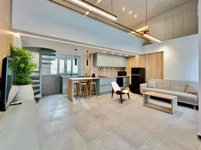 Loft 26 venue: upscale lounge area with kitchen island for VIP event or private corporate meeting.