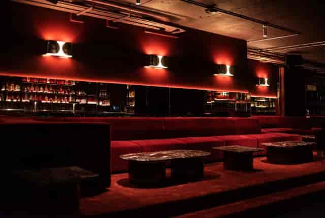 Lina Stores Manchester: Plush velvet banquettes in a lounge for VIP receptions and networking events.
