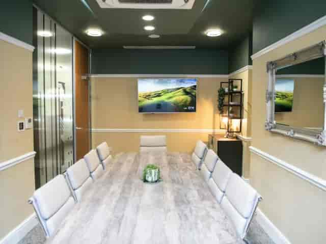 Modern boardroom at Wizu Workspace Park Place with AV display for professional business meetings.