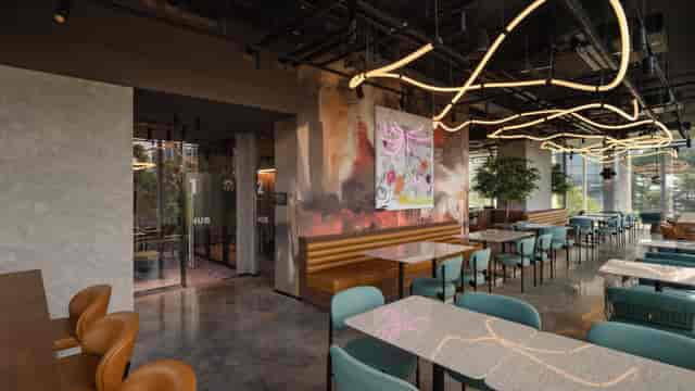 Modern breakout venue in ALBA London with industrial lighting for networking and workshops.