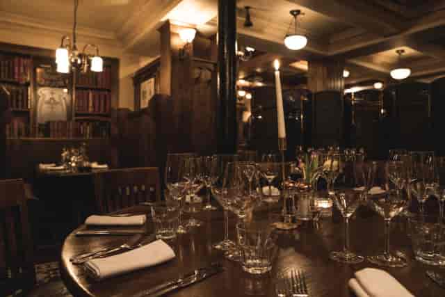 Upscale wood-paneled private dining room at Sam's Chop House for VIP board dinners.