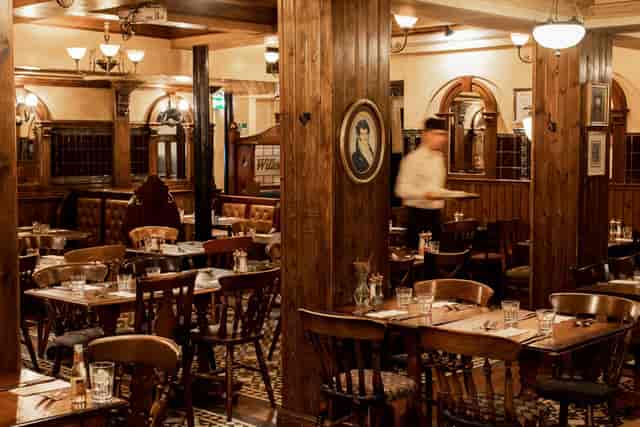 The Back Room at Sam’s Chop House: Wood-paneled private dining venue for intimate events.