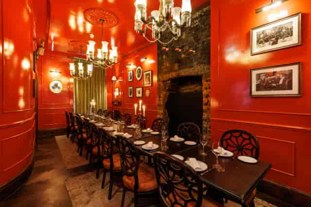 Private dining room at Six Portland Road with long table, ideal for intimate events and board dinners.