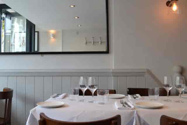 Minimalist restaurant venue at Six Portland Road for corporate dinners and networking events.