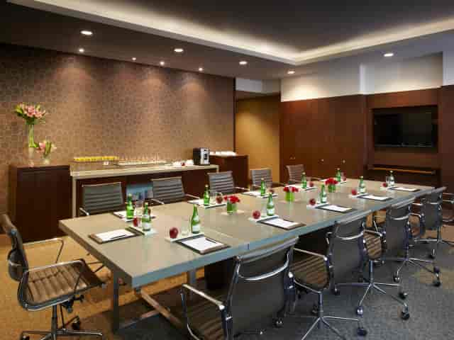 Sloane Suite boardroom setup with ergonomic seating for executive meetings and corporate events.