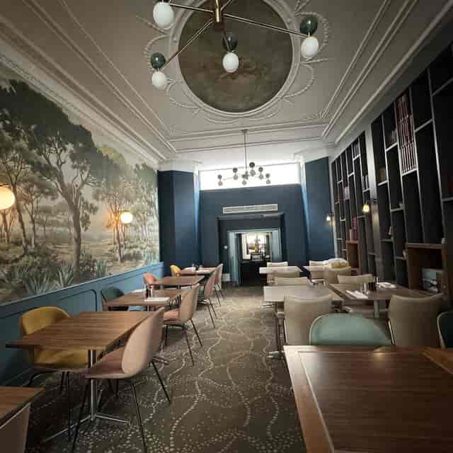 Cadogan Suite with atmospheric mural for boutique private dining and corporate event space.