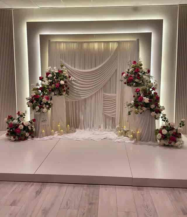XL Suite at FOMO Lounge featuring floral decor and elegant drapery for weddings and formal events.