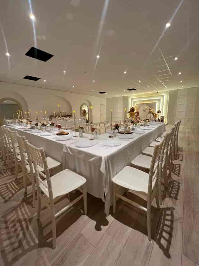 U-shaped banquet setup in The XL Suite at FOMO Lounge, ideal for boutique weddings and gala dinners.