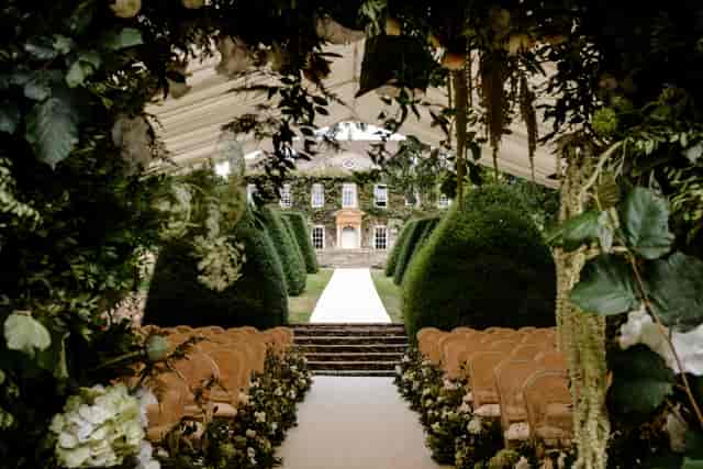 Semi-private outdoor wedding ceremony at ALBA London featuring botanical marquee decor.