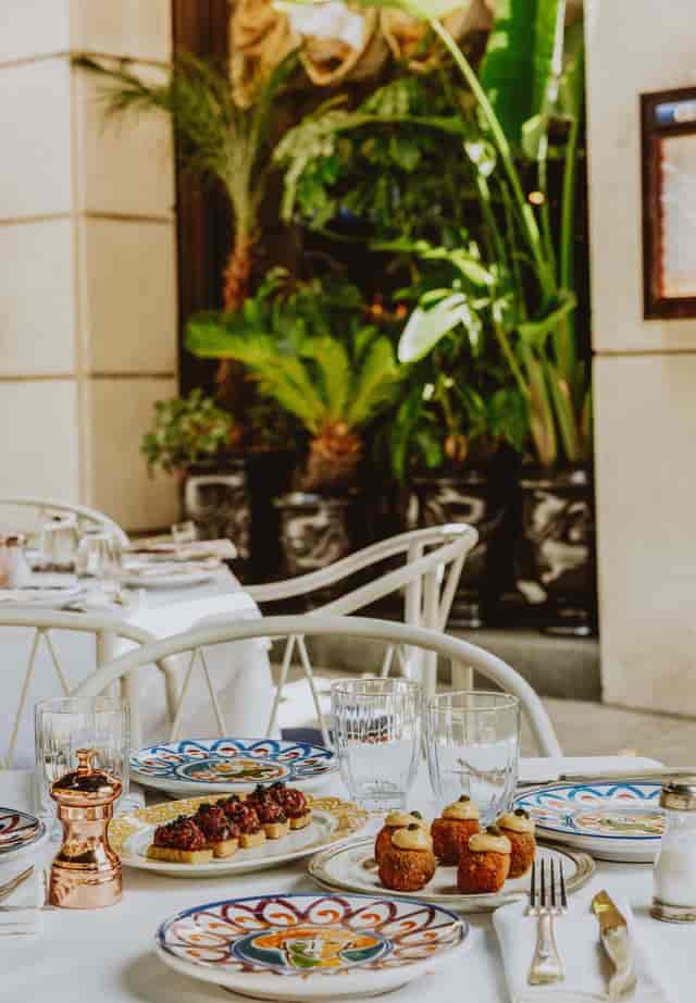 Upscale outdoor breakout session at The Villa Corner with sophisticated bistro seating.