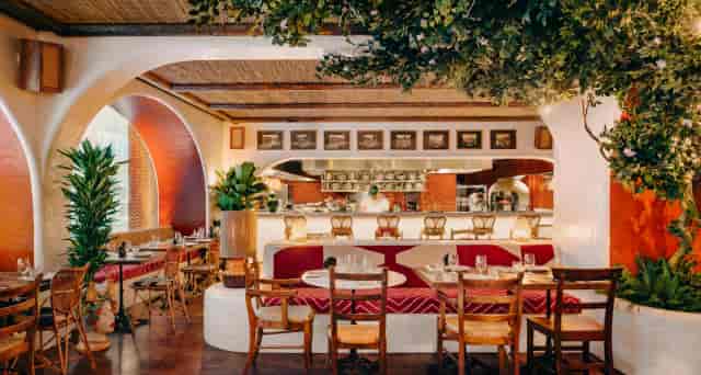 Circolo Popolare venue interior: lush biophilic design for corporate dinners and networking events.