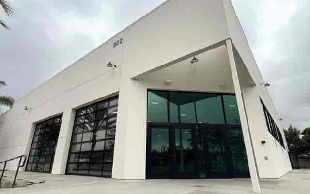 Industrial Pannikin Building venue with glass roll-up doors for product launches and pop-ups.
