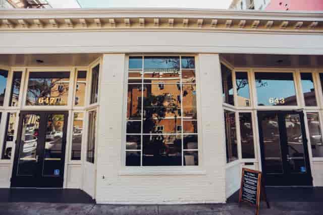 Boutique Sinclair storefront, neutral architectural venue for product launch and networking events.