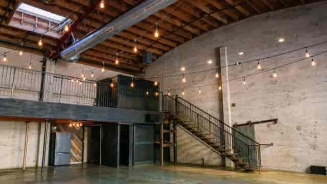 Industrial-chic event space at The Sinclair featuring mezzanine level for receptions and launches.
