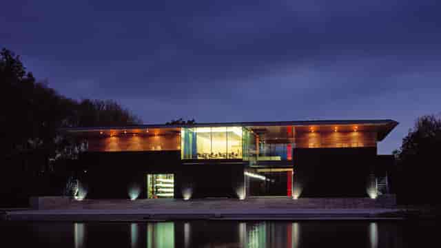 Boathouse Clubroom at twilight: waterfront venue for corporate retreats and evening galas.
