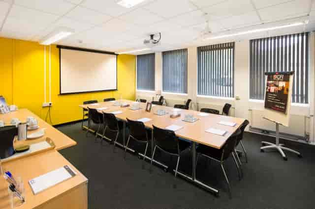 St Aldates Conference Centre boardroom with yellow wall for corporate training and workshops.