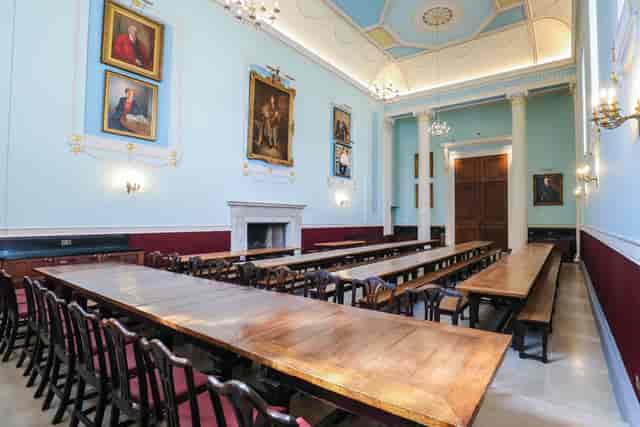 Worcester College dining hall with long communal benches for formal banquets and academic events.