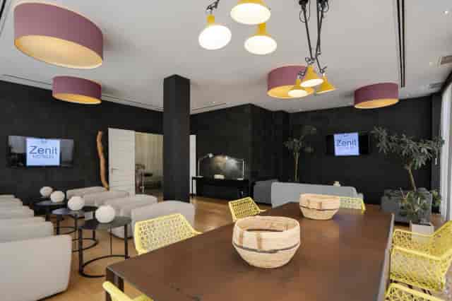 Contemporary breakout room with lounge seating for strategy sessions and networking events.