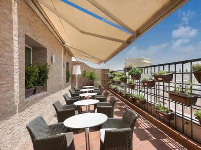 Princesa at Hotel Mayorazgo: intimate breakout space with vertical garden for corporate networking.