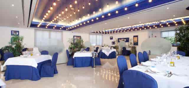 La Palmera dining room with custom lighting for corporate luncheons and private events.