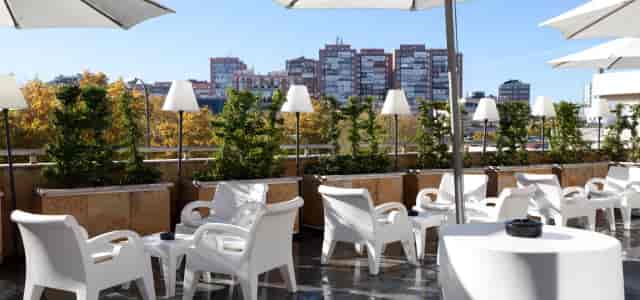 Modern rooftop terrace at La Palmera, Hotel Villamadrid for corporate networking and events.