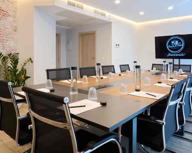 Modern boardroom at Hotel Puerta de Toledo with ergonomic seating for executive meetings.