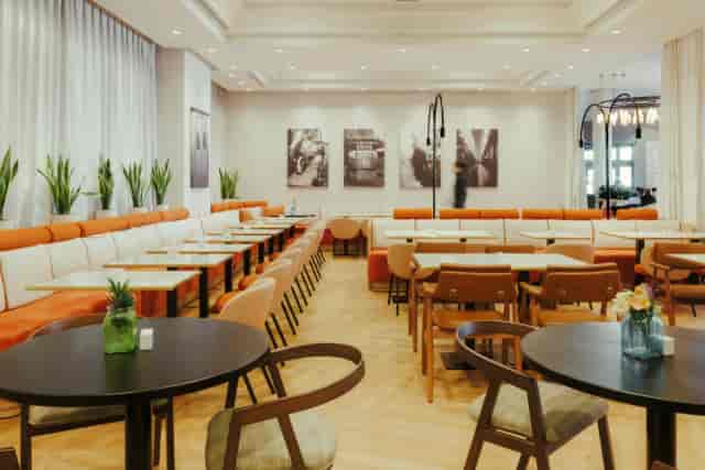 Modern Atocha Room restaurant space with modular seating for networking events and meetings.