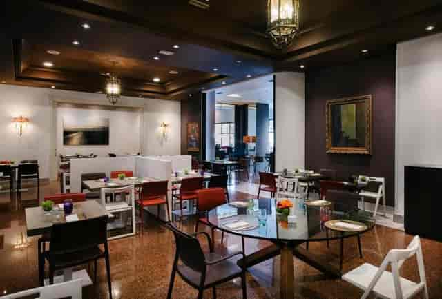Prado Room event space: contemporary hotel venue with modular seating for networking and banquets.