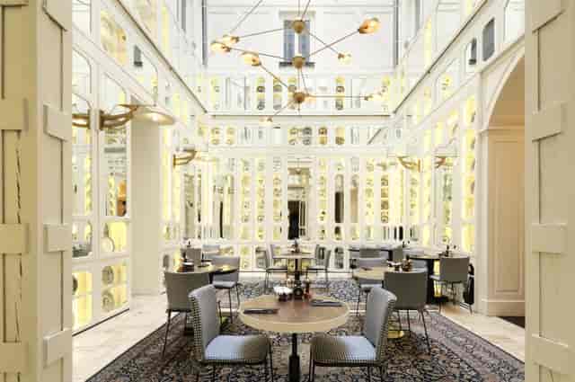 Magdalena at Hotel Sardinero Madrid: bright atrium for VIP dining and corporate networking events.