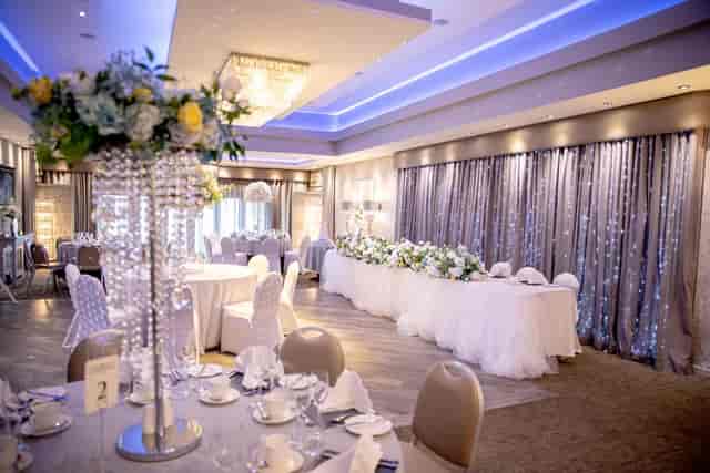 Connemara Suite wedding reception with crystal centerpieces and elegant blue lighting.