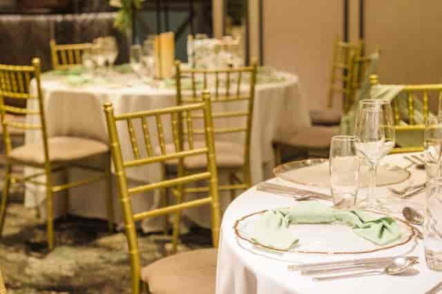 Clarkston Suite banquet setup with gold Chiavari chairs for formal weddings and corporate events.
