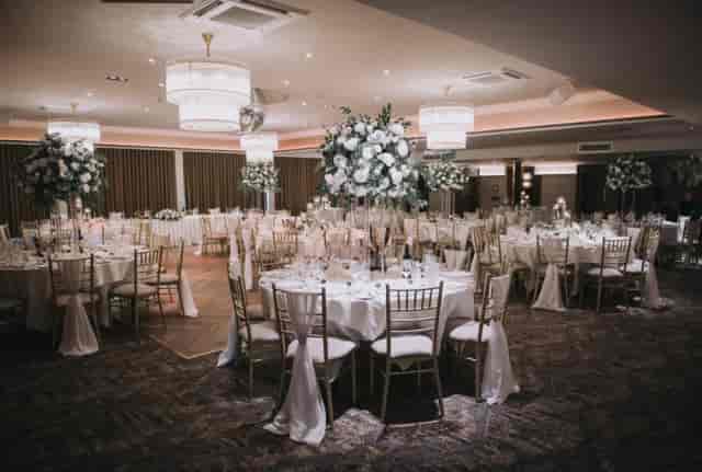 Clarkston Suite ballroom with floral centerpieces, perfect for luxury gala or wedding reception.
