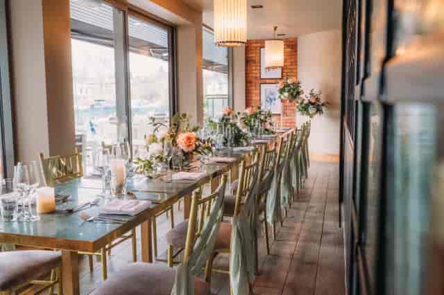Elegant private dining room at The Redhurst Hotel with long-table setup for bridal event.