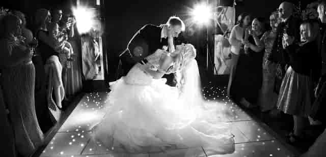 Grand Marquee wedding reception with lit dance floor for luxury event planning.
